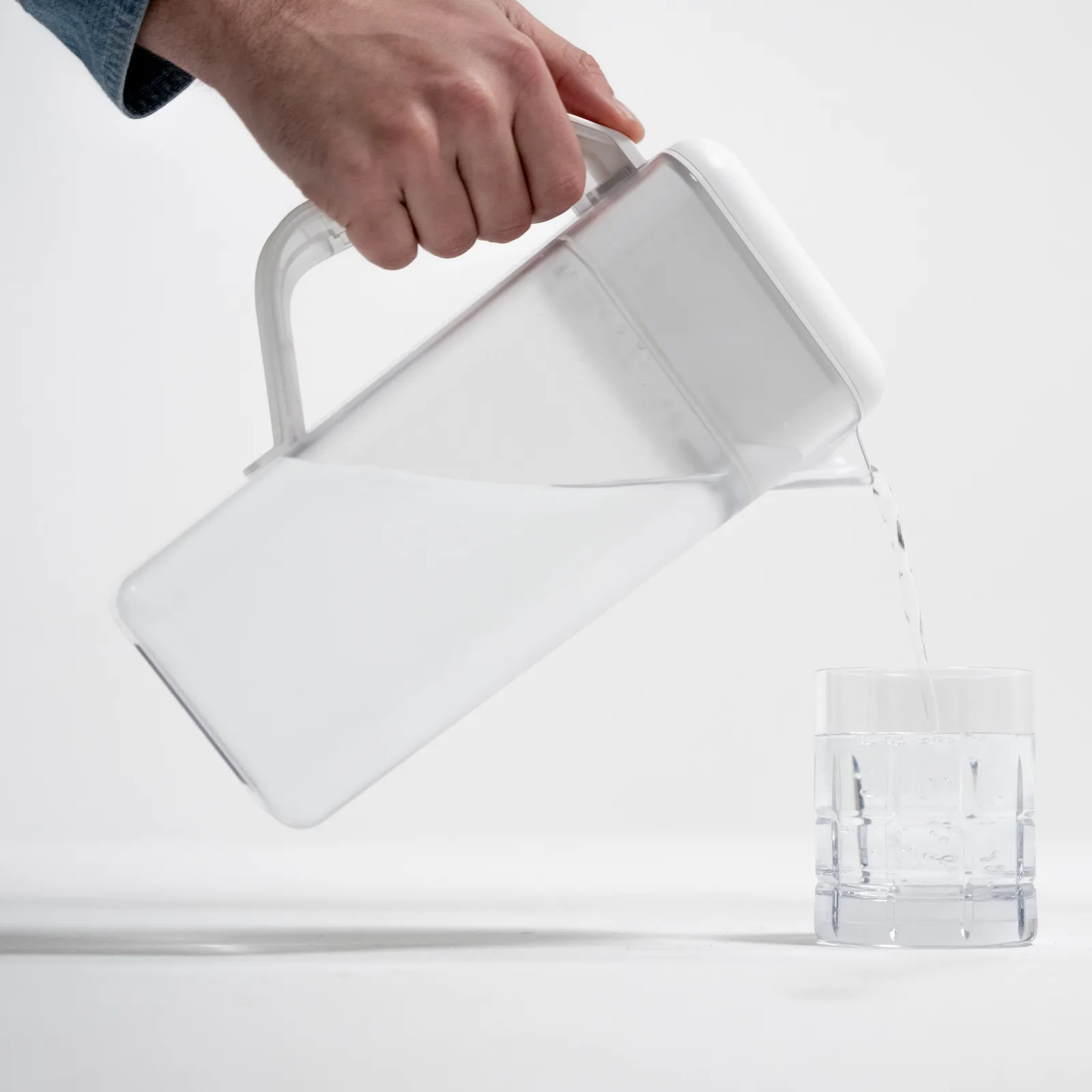 Pouring clean water from the Spout pitcher into a glass