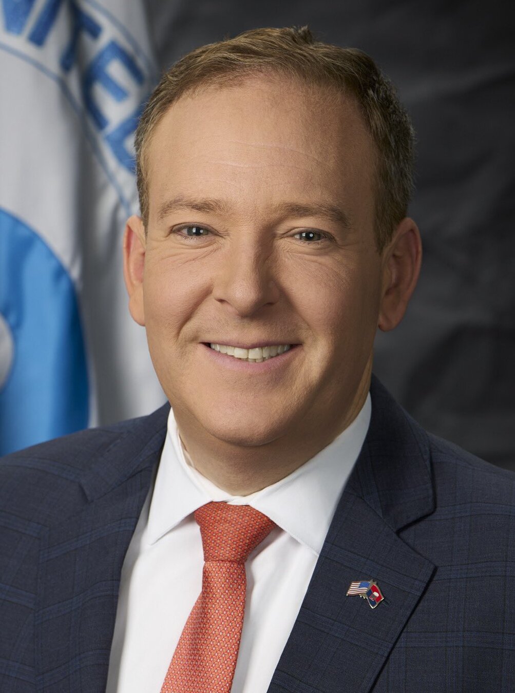 Official portrait of EPA Administrator Lee Zeldin in front of an EPA flag